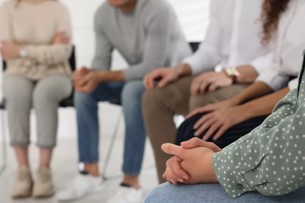 people-group-therapy-session-indoors-closeup