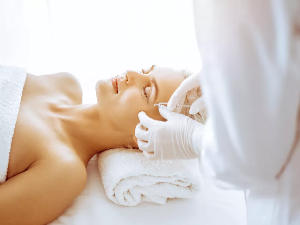 beautician-doctor-hands-doing-beauty-procedure-female-blonde-face-with-syringe-clinic-cosmetic-medicine-surgery-beauty-injections-concept