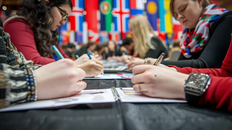 international-delegates-writing-notes-with-various-world-flags-background