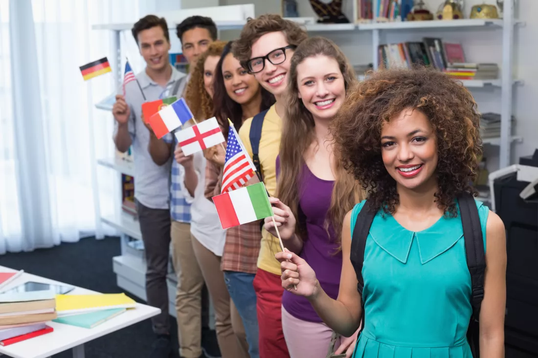 happy-students-waving-international-flags