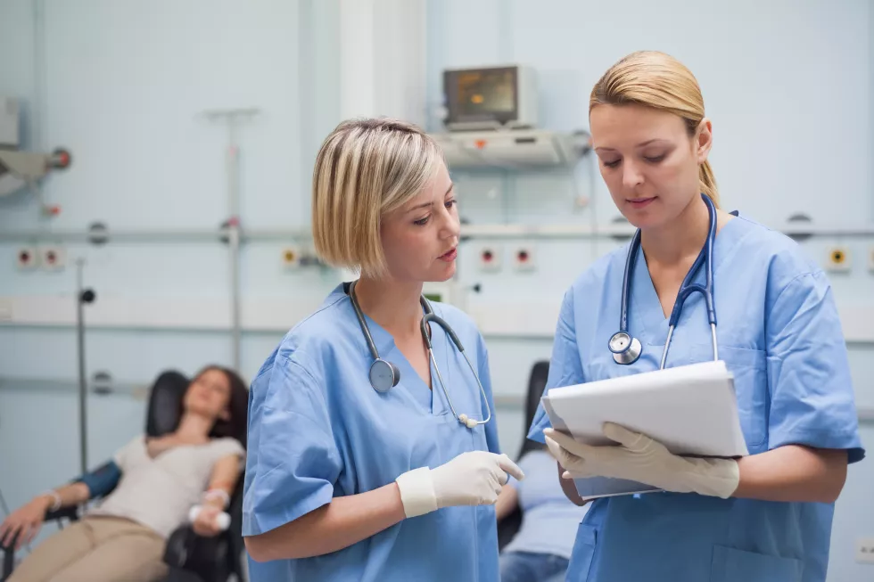 nurses-looking-clipboard