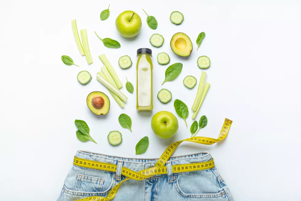 green-fruit-vegetables-smoothie-falling-into-jeans