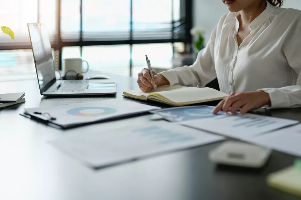 midsection-businesswoman-working-desk-office