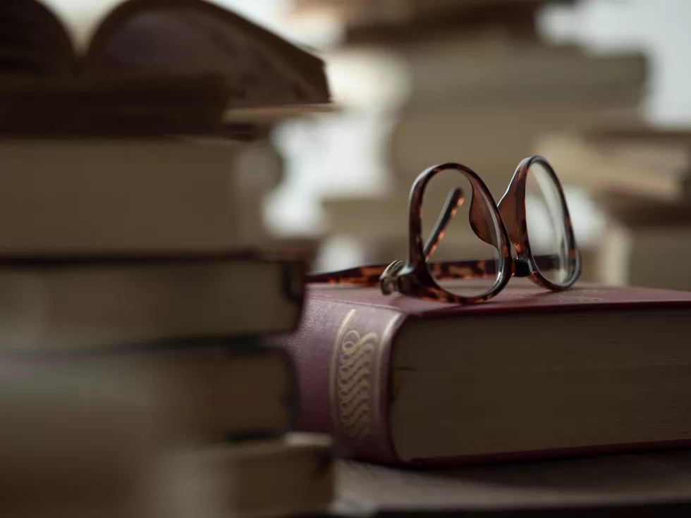 close-up-eyeglasses-books-table