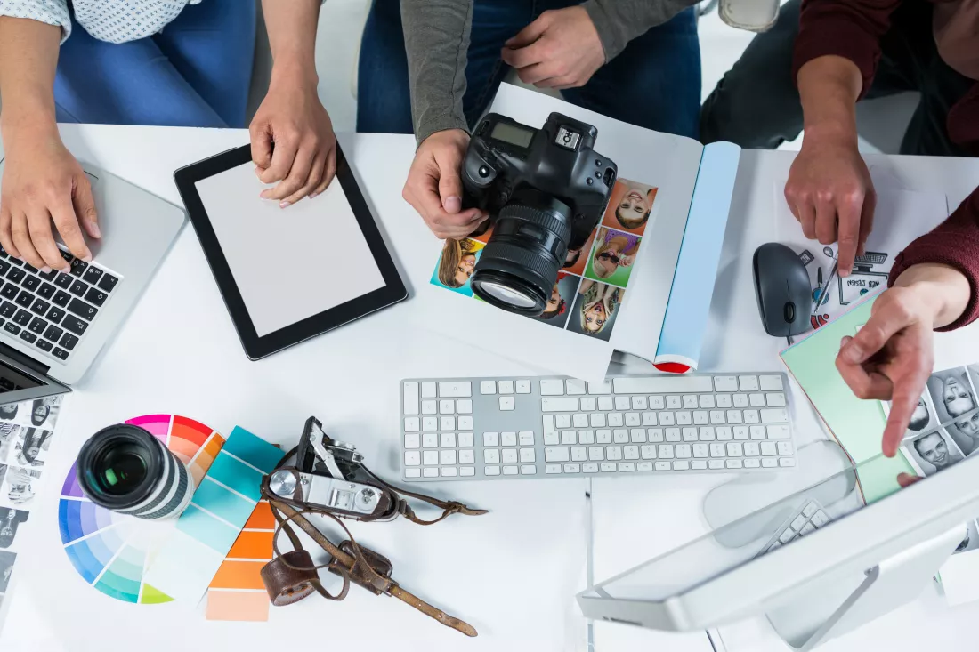team-photographers-working-computer-desk