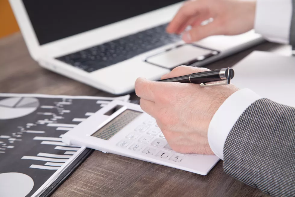 businessman-using-calculator-analysis-marketing-plan-business-accounting