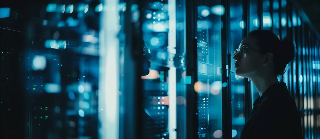 specialist-stands-dark-server-room-gazing-server-surrounded-by-highttech-enviroment-glass-walls