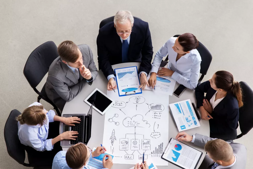 business-team-with-scheme-meeting-office