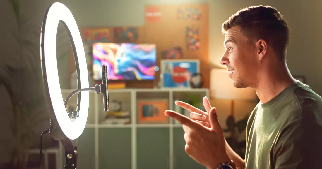 influencer-ring-light-smile-mobile-streaming-follower-interaction-content-creation-man-gamer-phone-home-subscriber-engagement-introduction-connectivity-profile