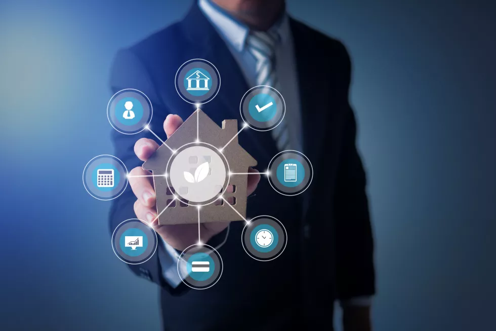 businessman-show-smart-home-model-building-with-responsible-environment(1)