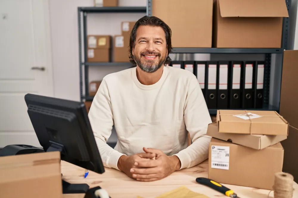 handsome-middle-age-man-working-small-business-ecommerce-with-happy-cool-smile-face-lucky-person
