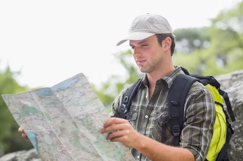 young-hiker-reading-map