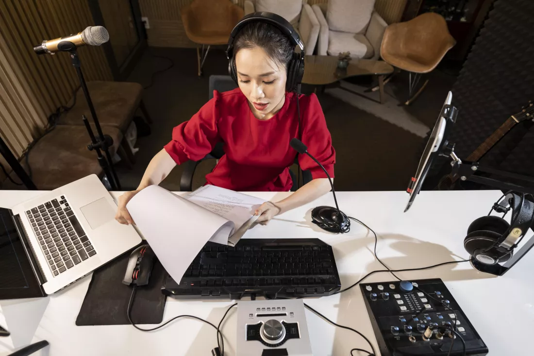 high-angle-woman-working-radio-with-professional-equipment