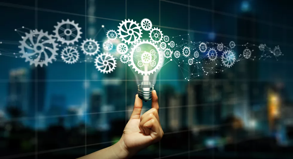 businessman-hand-holding-light-bulb-with-cog-inside-business-idea-bulb-gear-icon-network-connection-with-creative-inspiration-innovation-leadership-teamwork-idea-vision-plan-concept