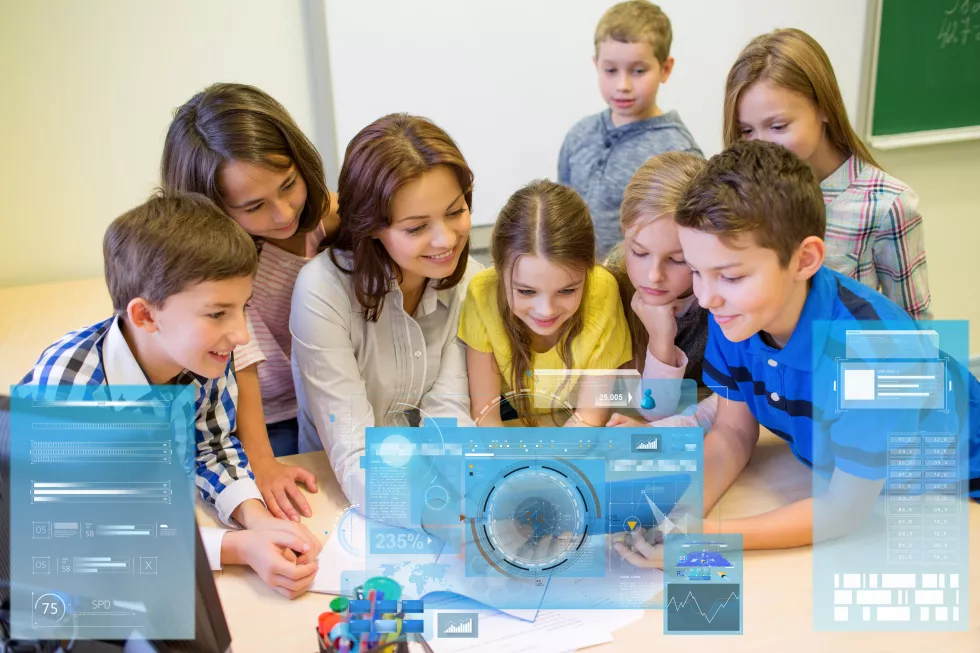 education-elementary-school-learning-technology-people-concept-group-kids-with-teacher-looking-tablet-pc-computer-classroom-virtual-screens-projections