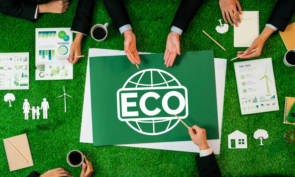 top-view-panoramic-eco-symbol-green-grass-table-with-business-people-planning-alternative-energy-utilization-greener-sustainable-earth-as-corporate-social-responsibility-quaint