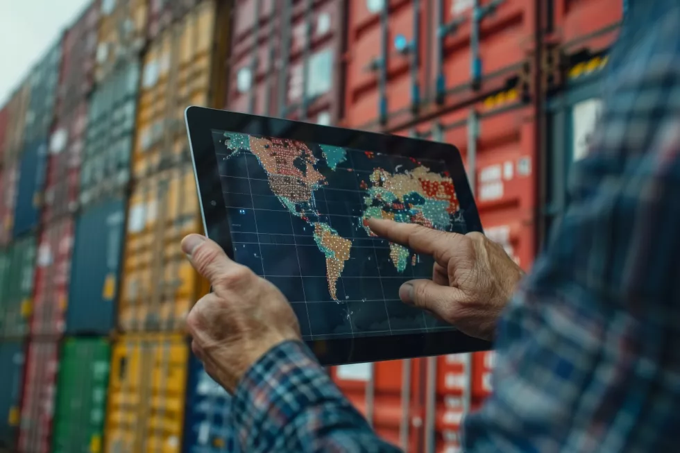 man-is-holding-tablet-with-map-world-it