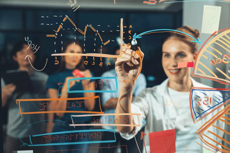 young-beautiful-businesswoman-writing-business-plan-glass-wall-tracery