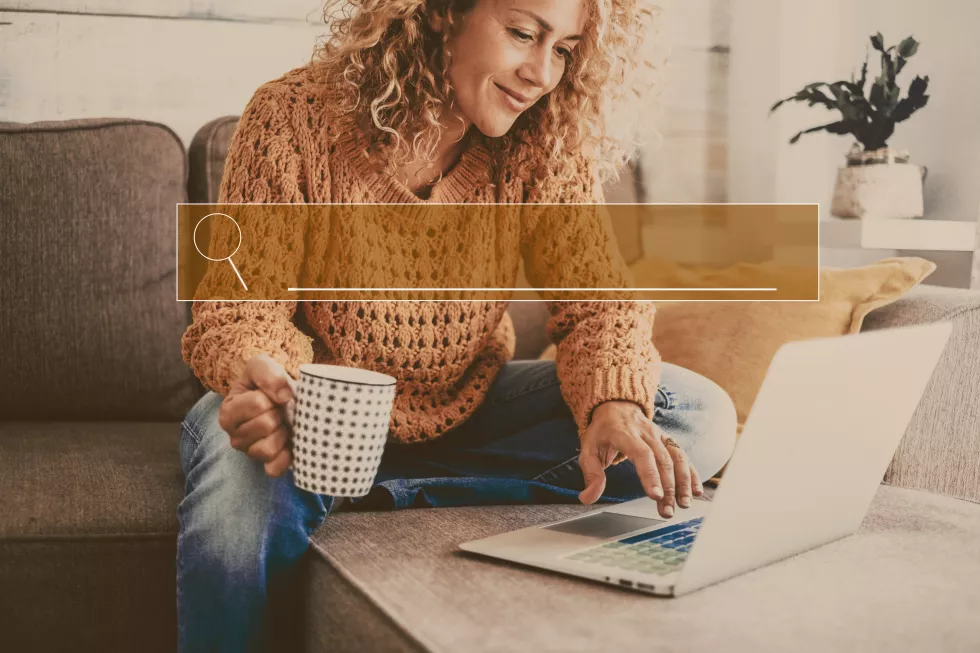 midsection-woman-using-laptop-home