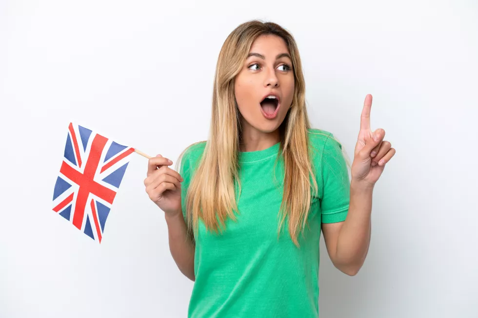 young-uruguayan-woman-holding-united-kingdom-flag-isolated-white-background-intending-realizes-solution-while-lifting-finger-up