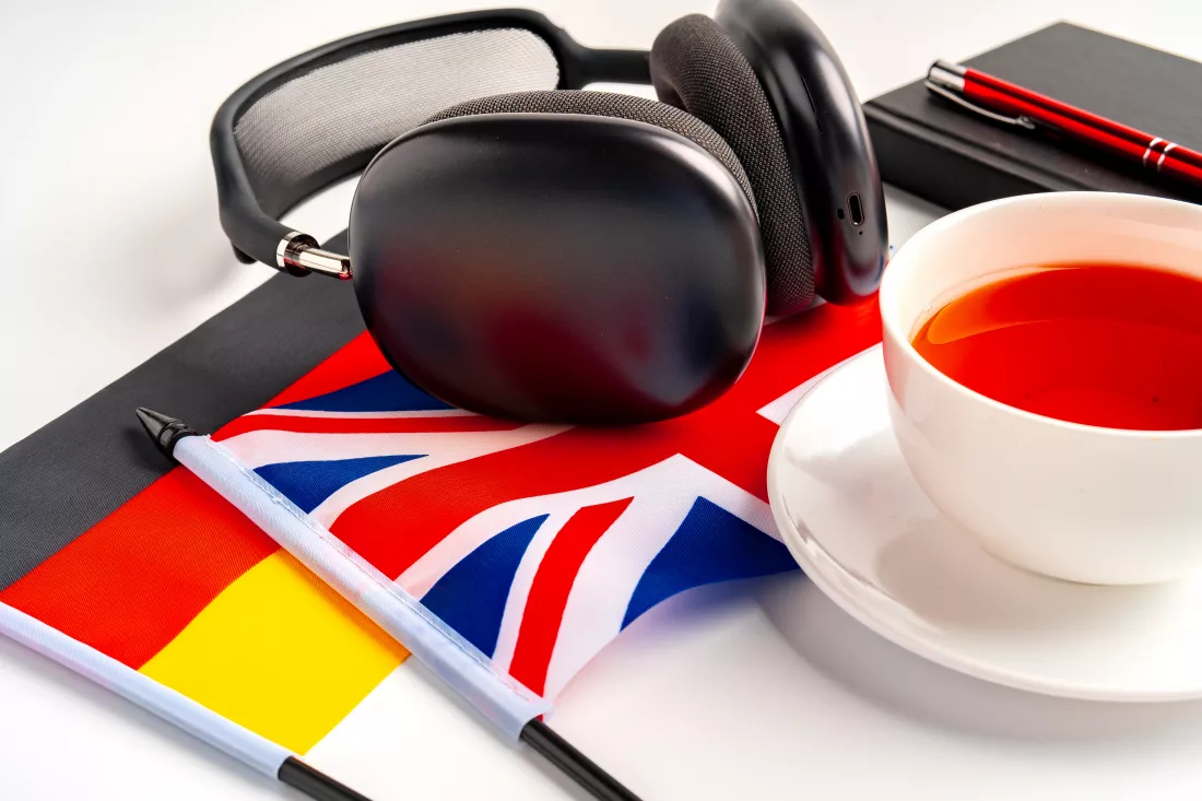 german-british-flags-with-notepad-white-background