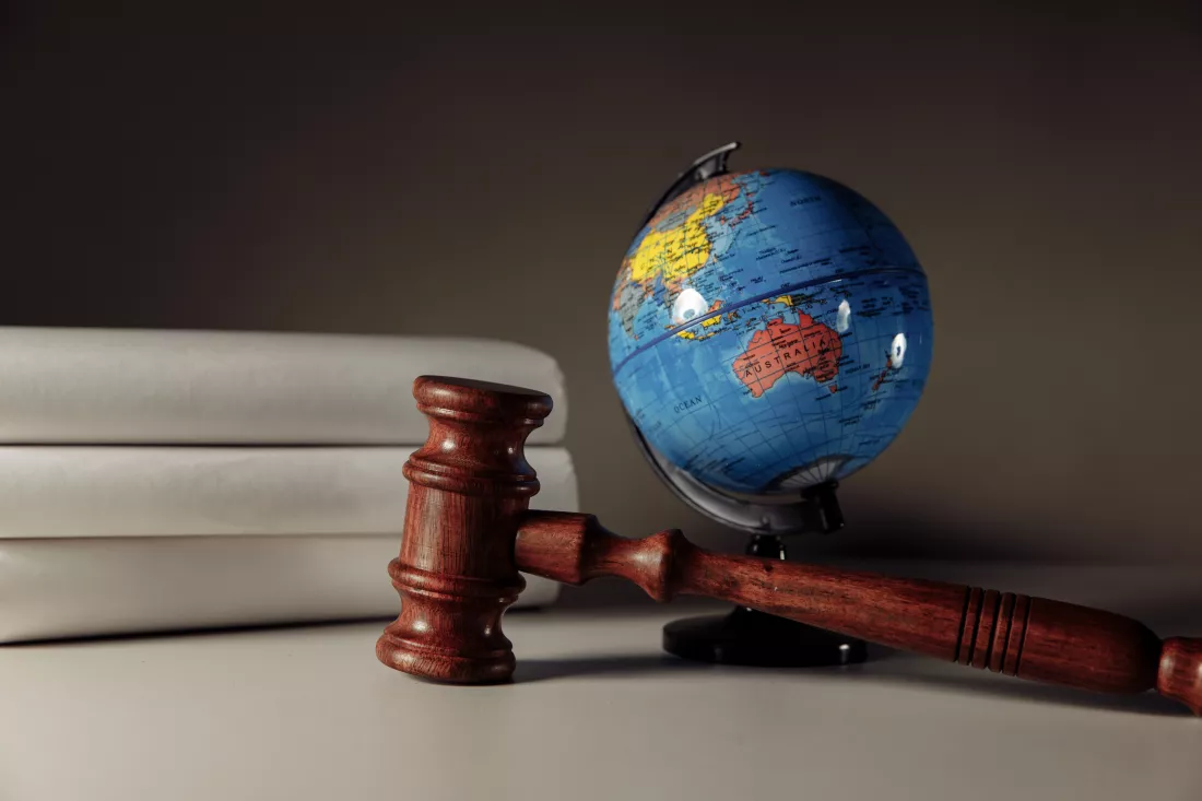 wooden-gavel-globe-desk-international-law-justice-court-concept