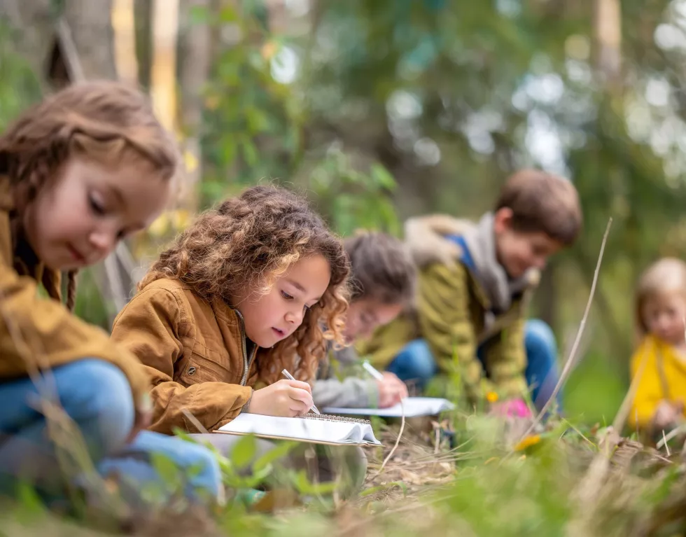 group-children-field-trip-nature-their-hands-holding-notebooks-pens-generative-ai
