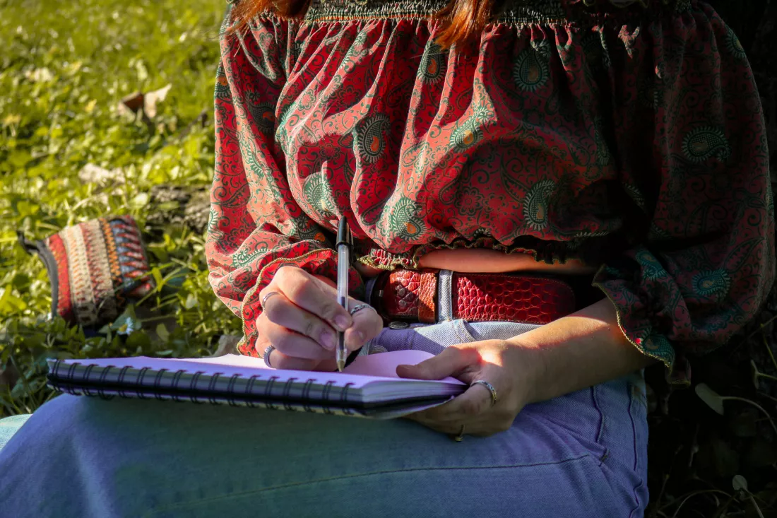 midsection-woman-writing-book