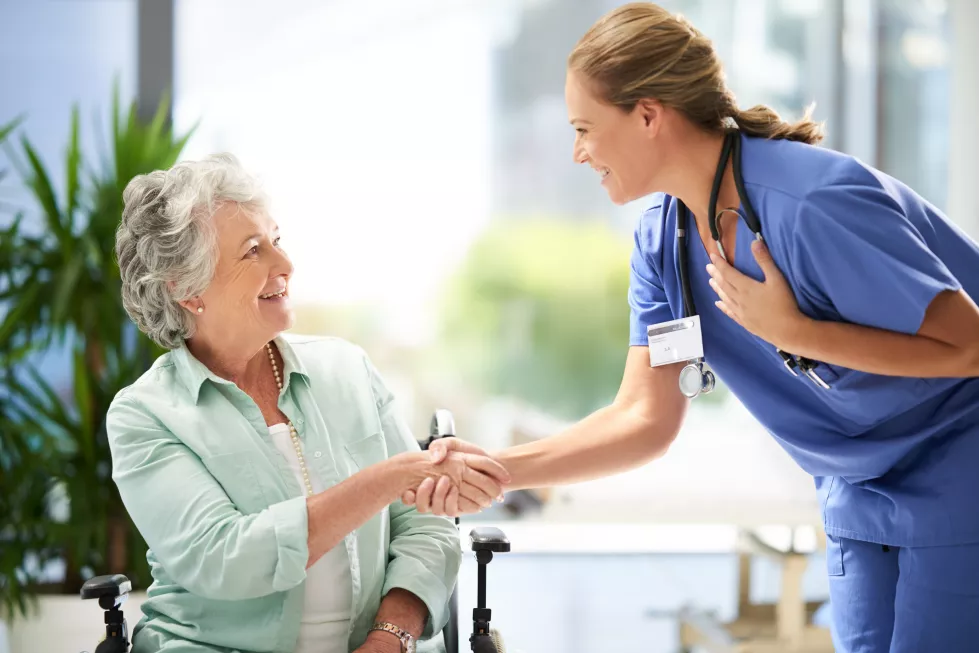 handshake-nurse-senior-advice-wheelchair-with-medical-results-surgery-success-news-hospital-healthcare-clinic-with-women-nursing-staff-with-care-support-elderly-person