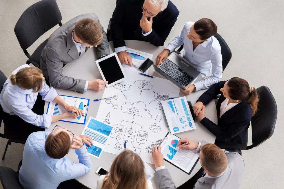 business-team-with-scheme-meeting-office