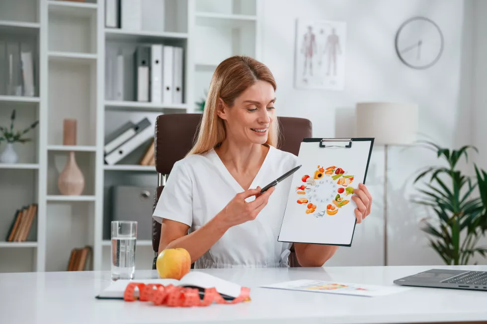 with-picture-food-vitamins-young-female-doctor-white-coat-is-indoors(1)