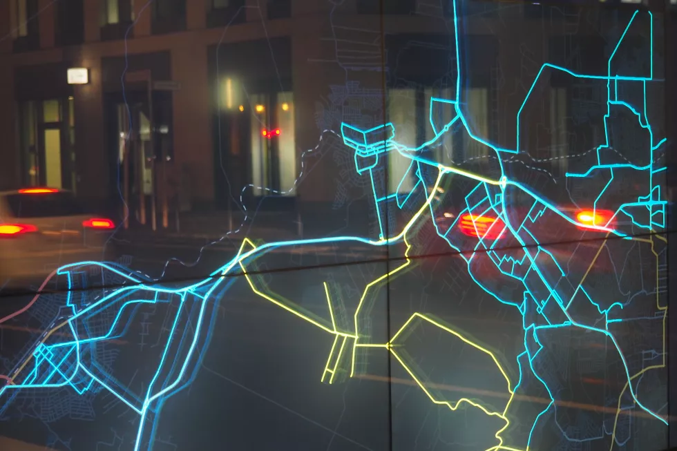 illuminated-road-map-glass-against-building