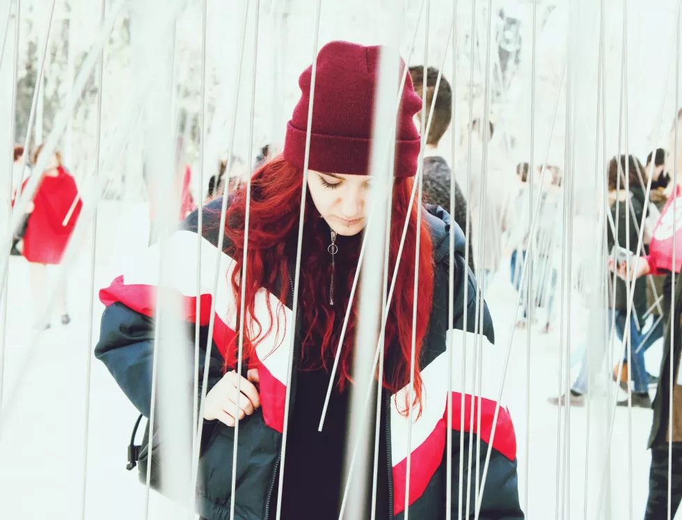 woman-warm-clothing-standing-amidst-strings(1)