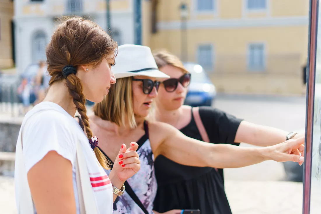 smiling-women-standing-city