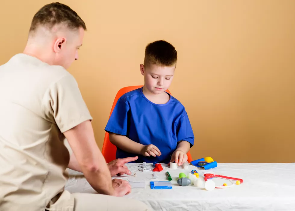 hospital-worker-medical-service-analysis-laboratory-kid-little-doctor-sit-table-medical-tools-health-care-pediatrician-concept-medical-examination-boy-cute-child-his-father-doctor