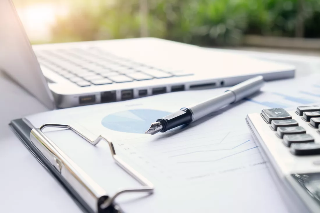 business-concept-with-copy-space-office-desk-table-with-pen-focus-analysis-chart-computer-notebook-cup-coffee-desk-vintage-tone-retro-filter-selective-focus