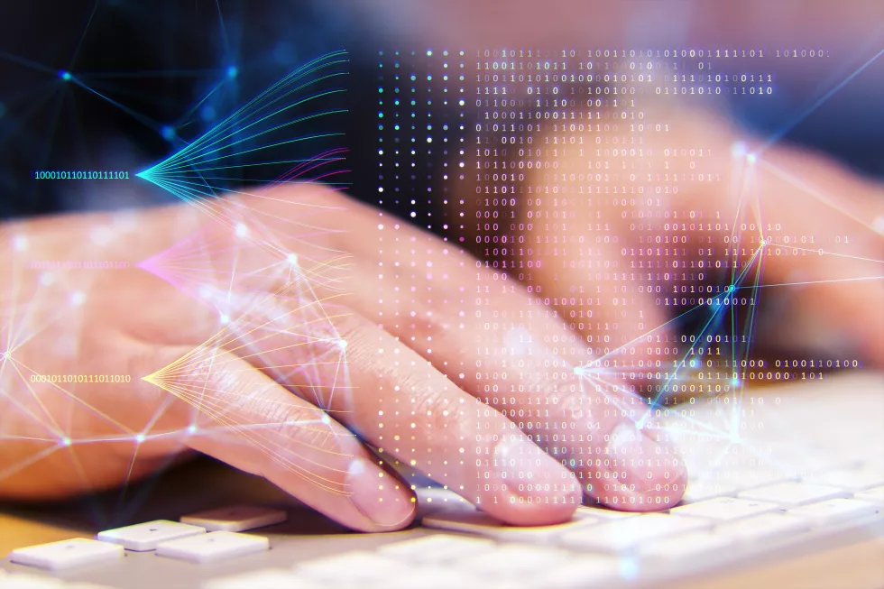 hand-typing-keyboard-with-digital-network-binary-code-overlay-symbolizing-technology-data-processing-bokeh-background(1)