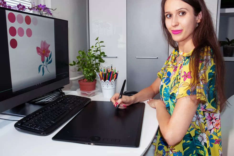 smiling-woman-graphic-designer-fashion-designer-is-working-computer